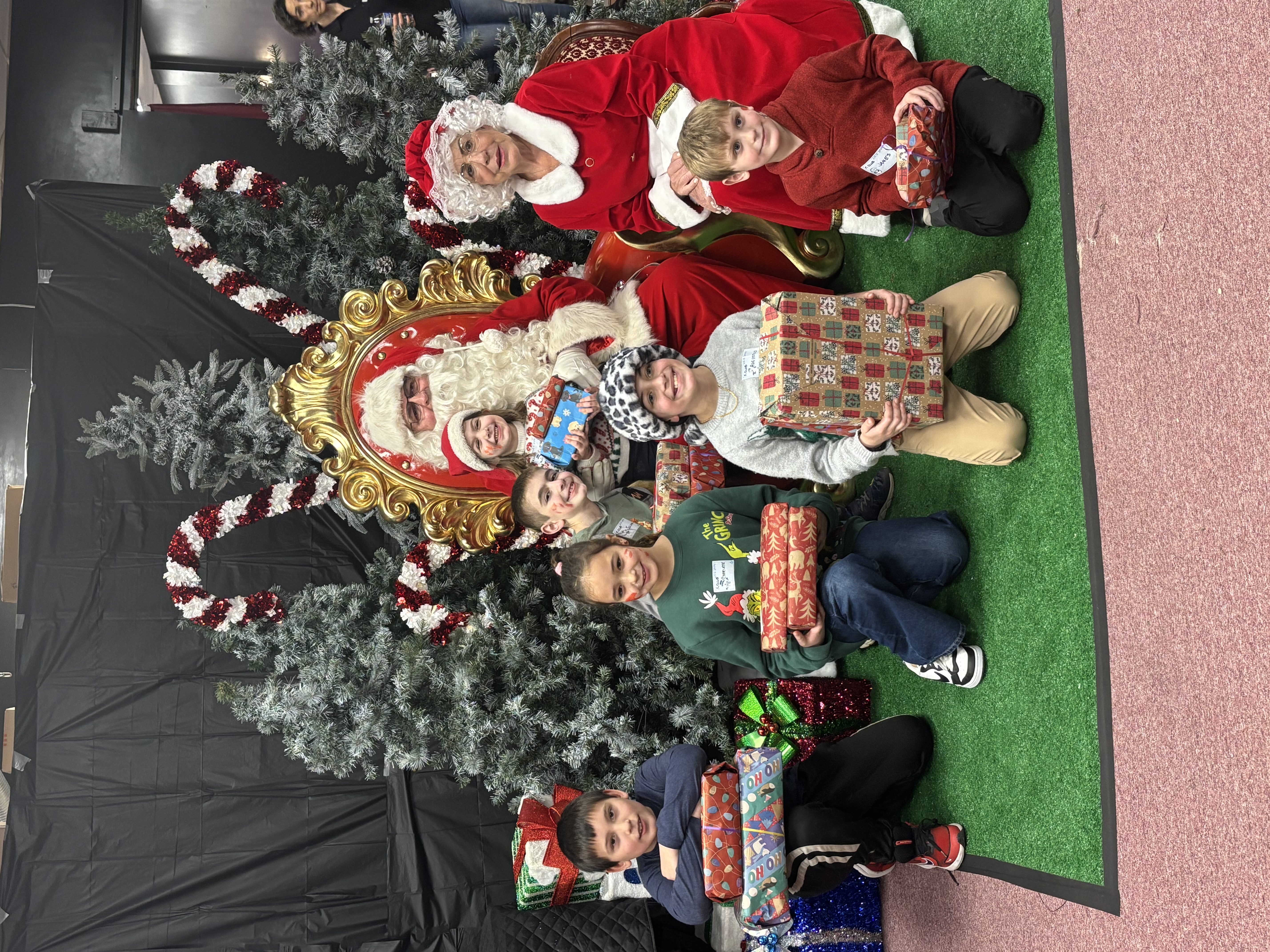Kids receiving presents from Santa