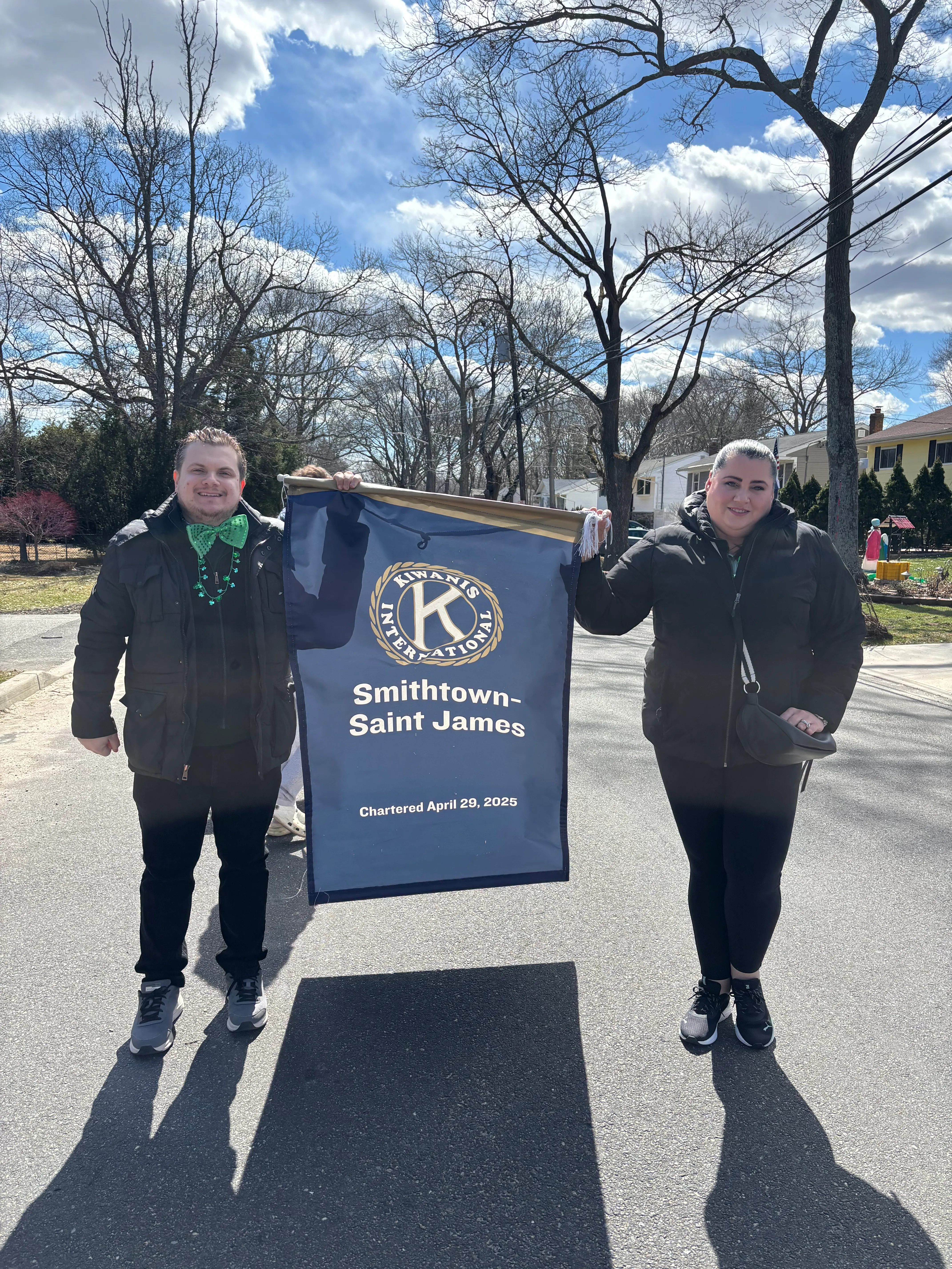 Members with the Smithtown-Saint James Kiwanis banner