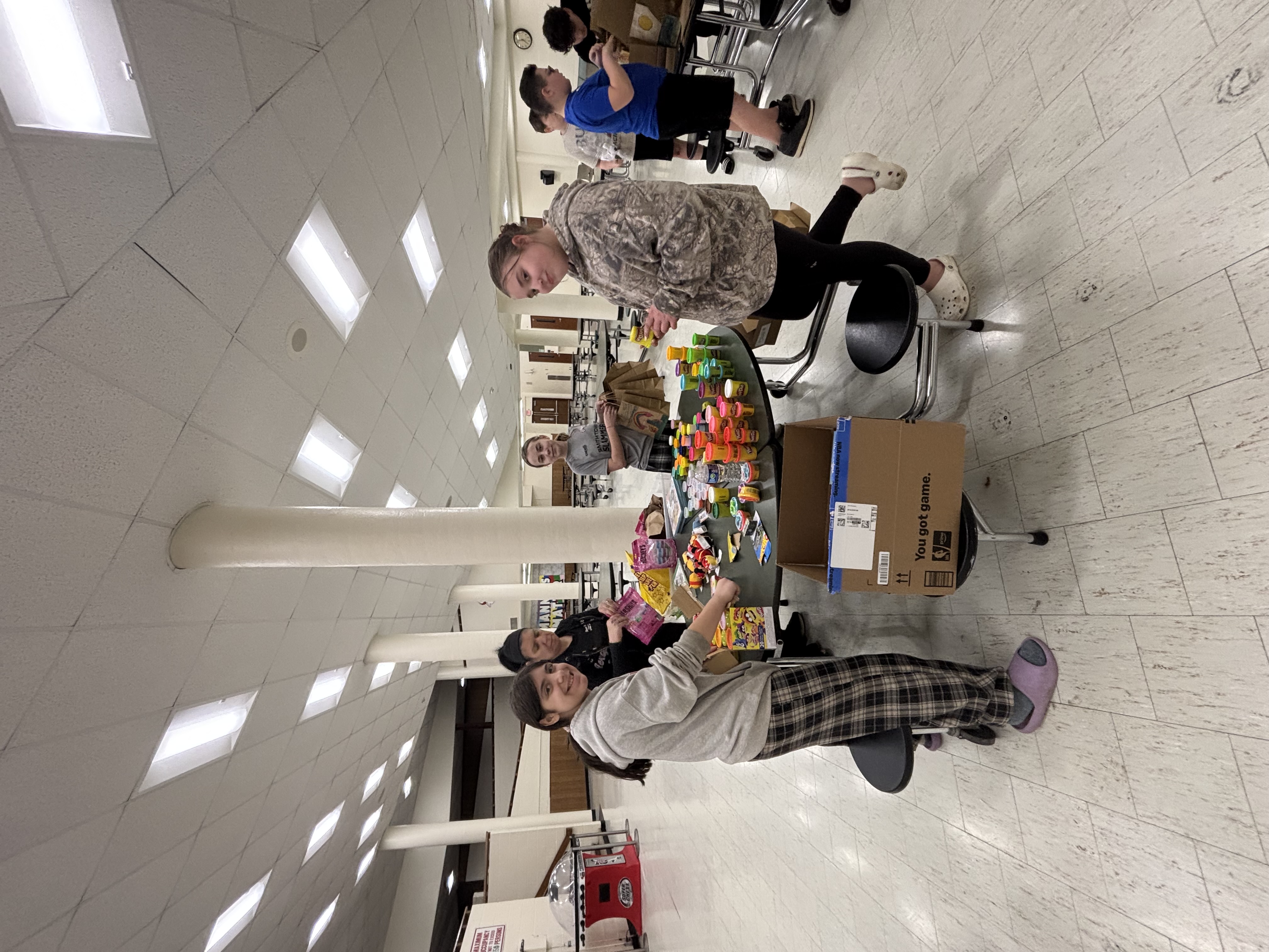 K-Kids sorting supplies for a service project