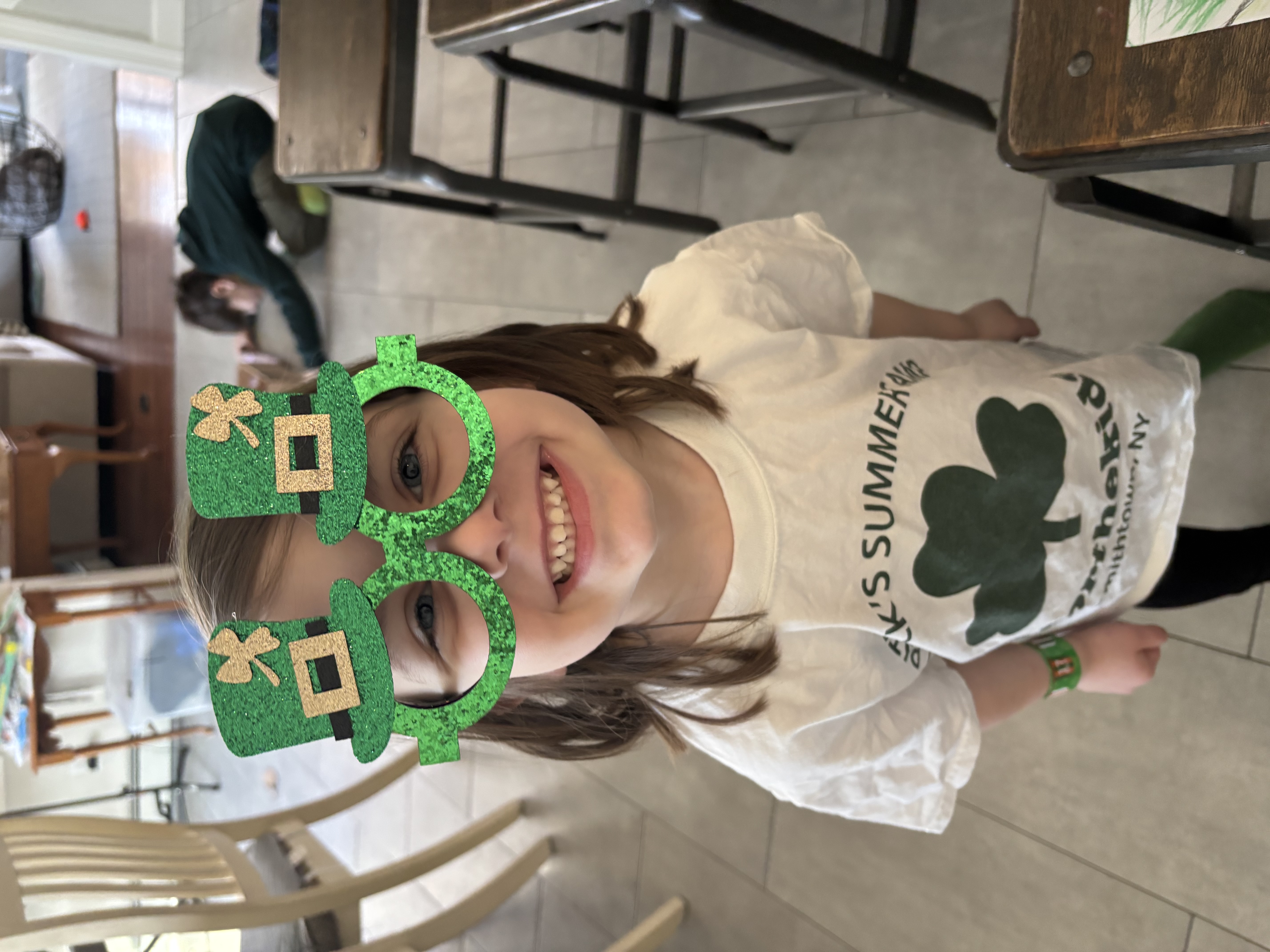 Young girl with St. Patrick's Day glasses